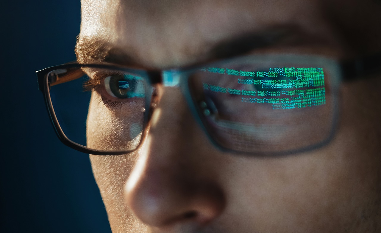 engineer looking at computer screen working with data