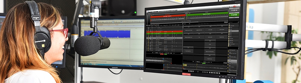 Person in speaking into microphone in a studio