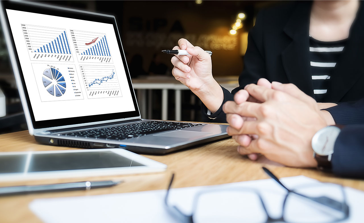 Person analyzing data on computer screen