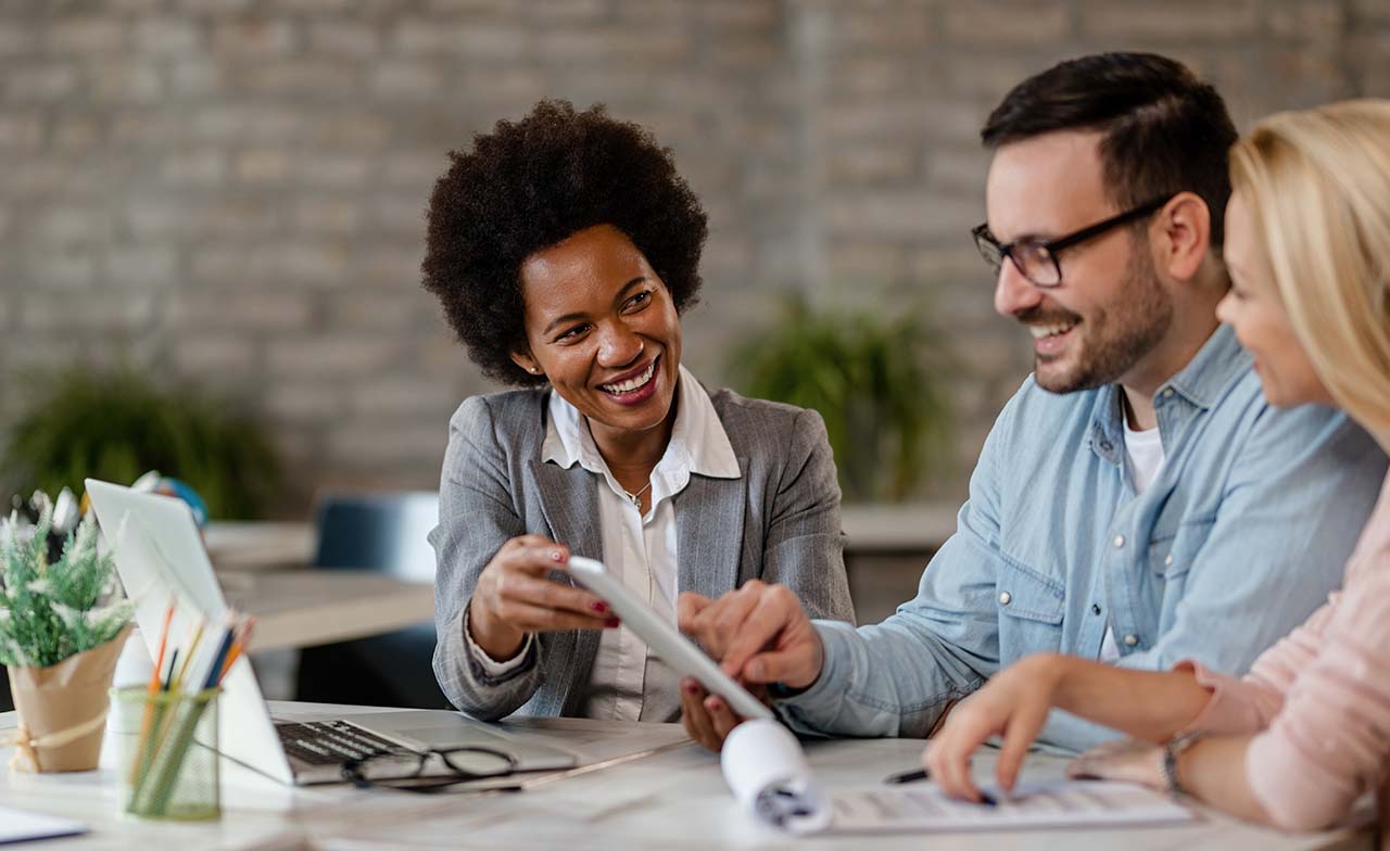 Professionals discussing with tablet