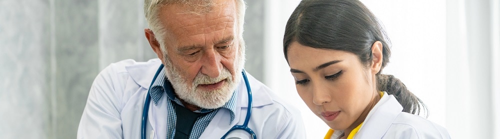 Physicians reviewing data on a tablet