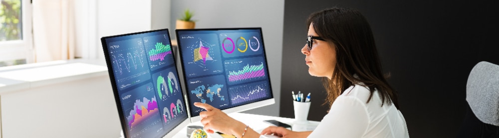 Analyst viewing AI-powered data on monitor