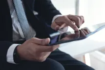 Man holding his Ipad - digital transformation