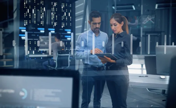 AI consultants looking at tablet together