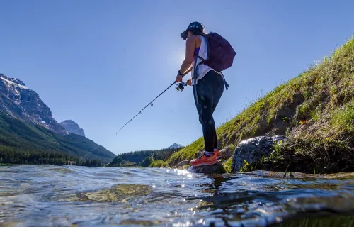 person fishing at a river in Alberta, Canada