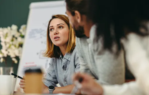 Young business woman having a discussion with colleagues