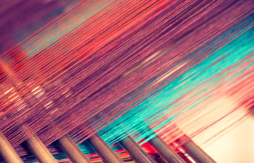 Colorful threads in a loom