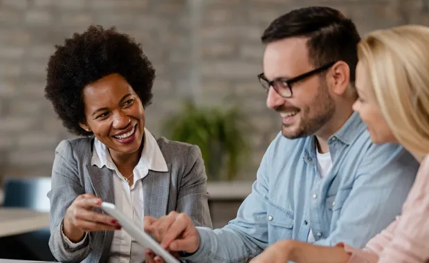 Consultant discussing with two clients