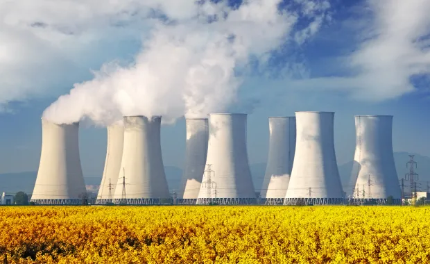 Cooling towers at a power plant emitting steam