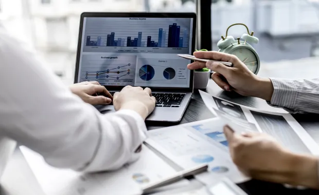 Professionals discussing about stats