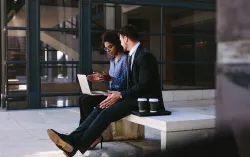 man and woman discussing on their project