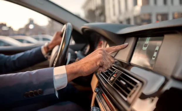 Man using parking assist system in a car