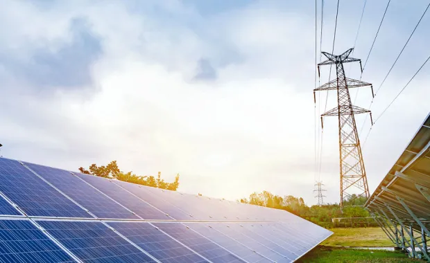 solar panels and electricity tower
