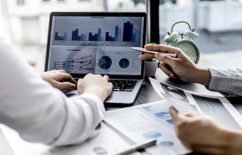 Professionals discussing about stats