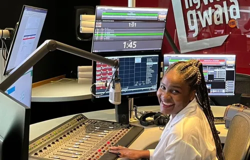 Broadcaster sitting in SABC radio studio