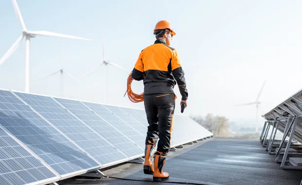 utilities worker checking solar panels